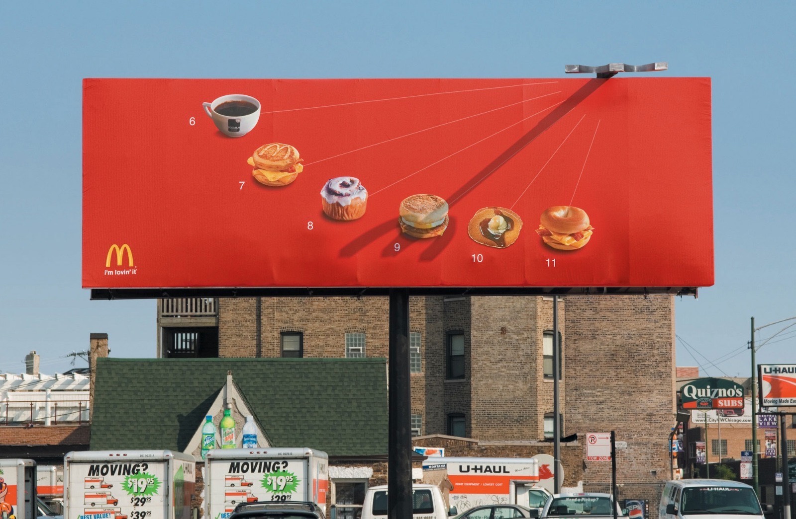 McDonald's Billboard Ad with Built-In Sundial pointing towards appropriate menu item